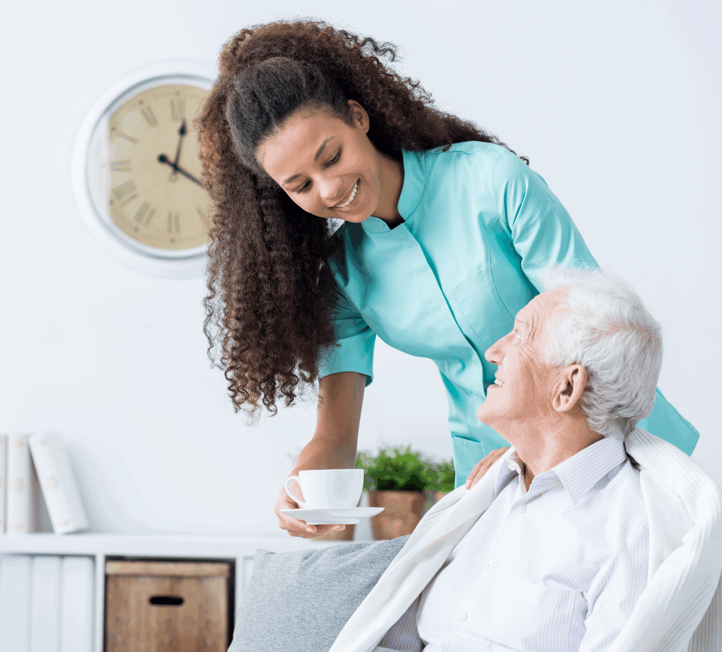 Caregiver offering tea to elderly man