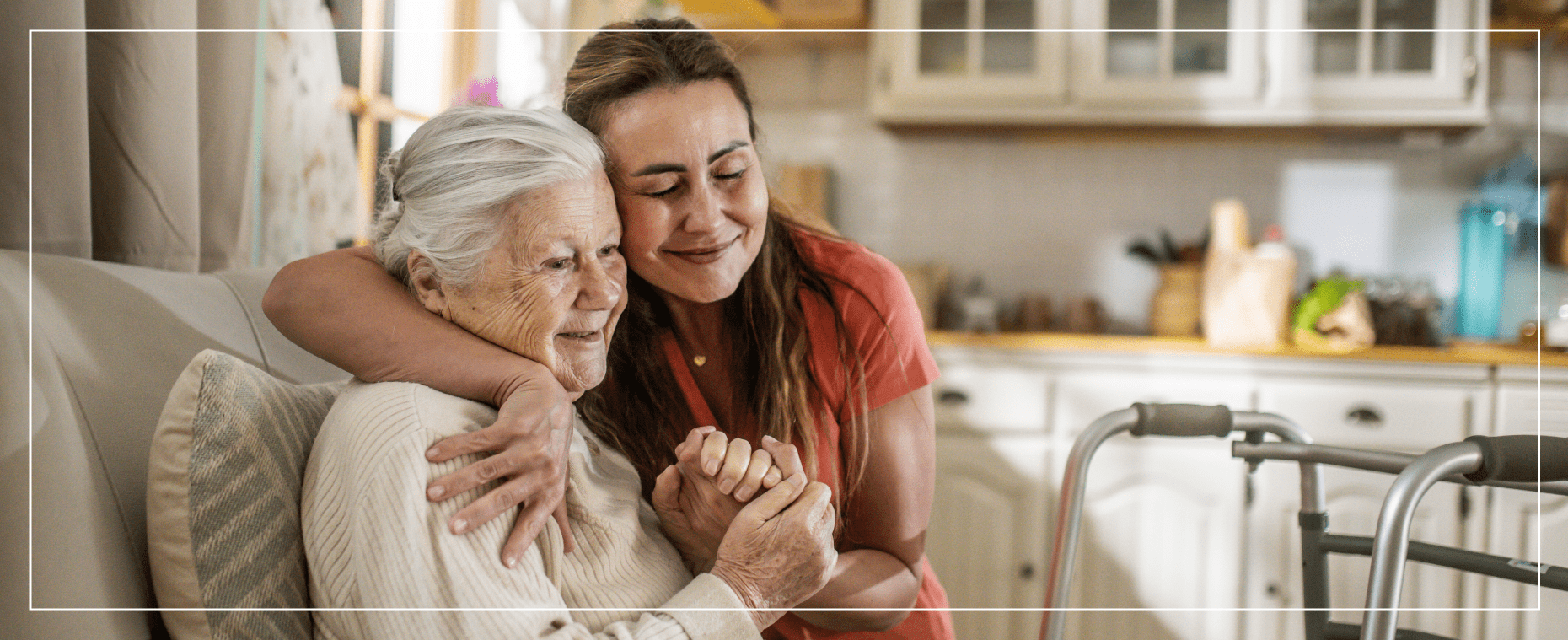 Senior woman embraced by caregiver