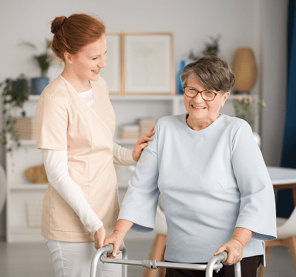 Nurse helping senior woman walk