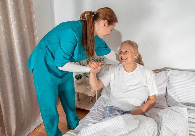 Caregiver helping senior patient